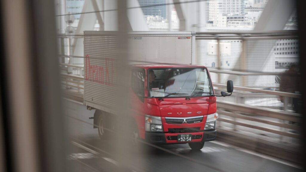 courier delivering package to small business customer